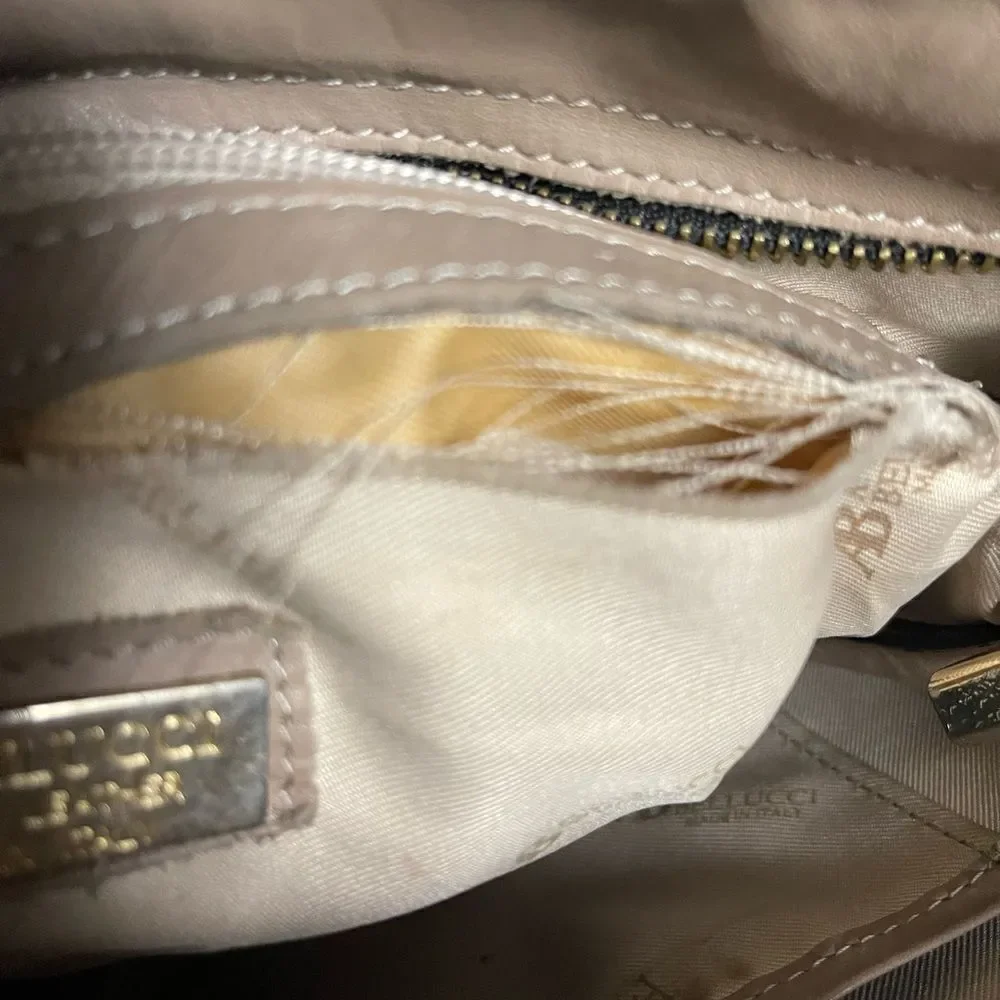 A. Bellucci leather Khaki Satchel with patch work accents, gay, burgundy &black.